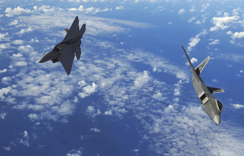 29. U.S. Air Force F-22A Raptor Stealth Fighters Fly Over the Western Pacific Ocean, February 16, 2010, Territory of Guam, USA. Photo Credit: Staff Sgt. Jacob N. Bailey, United States Air Force; Defense Visual Information (DVI, http://www.DefenseImagery.mil, 100216-F-5964B-549) and United States Air Force (USAF, http://www.af.mil), United States Department of Defense (DoD, http://www.DefenseLink.mil or http://www.dod.gov), Government of the United States of America (USA).