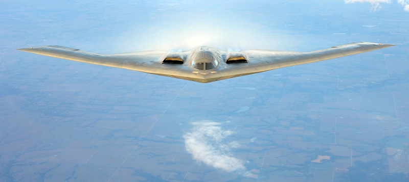 42. A U.S. Air Force B-2 Spirit Stealth Bomber With White Vapor (Condensation), September 9, 2011, State of Kansas, USA. Photo Credit: Senior Airman Courtney Witt, United States Air Force; Defense Visual Information (DVI, http://www.DefenseImagery.mil, 110909-F-QH266-191) and United States Air Force (USAF, http://www.af.mil), United States Department of Defense (DoD, http://www.DefenseLink.mil or http://www.dod.gov), Government of the United States of America (USA).