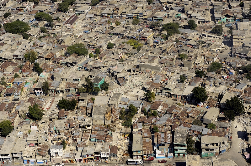 43. Another Aerial View of Earthquake-Damaged Buildings In the City of Port-au-Prince, January 22, 2010, Republique d'Haiti (Repiblik d' Ayiti) - Republic of Haiti. Photo Credit: Master Sgt. (MSgt) Russell E. Cooley IV, United States Air Force; Defense Visual Information (DVI, http://www.DefenseImagery.mil, 100122-F-9712C-108) and United States Air Force (USAF, http://www.af.mil), United States Department of Defense (DoD, http://www.DefenseLink.mil or http://www.dod.gov), Government of the United States of America (USA).
