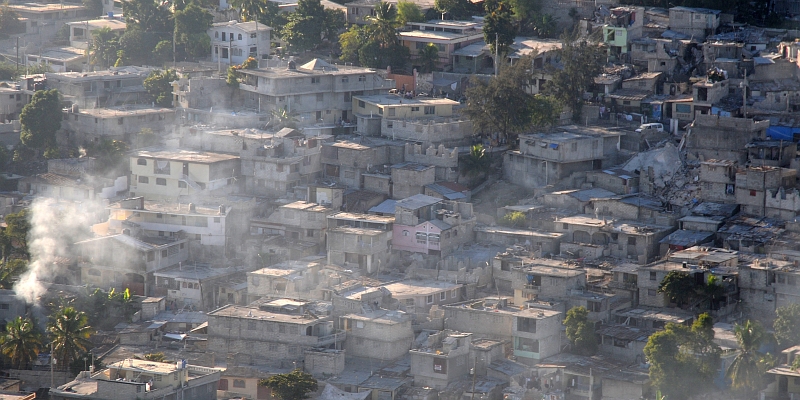 16. Smoke Billows From Earthquake-Damaged Homes and Businesses, January 15, 2010, Port-au-Prince, Republique d'Haiti (Repiblik d' Ayiti) - Republic of Haiti. Photo Credit: Mass Communication Specialist 2nd Class Candice Villarreal, Navy News Service - Eye on the Fleet (http://www.news.navy.mil/view_photos.asp, 100115-N-6247V-153), United States Navy (USN, http://www.navy.mil), United States Department of Defense (DoD, http://www.DefenseLink.mil or http://www.dod.gov), Government of the United States of America (USA).