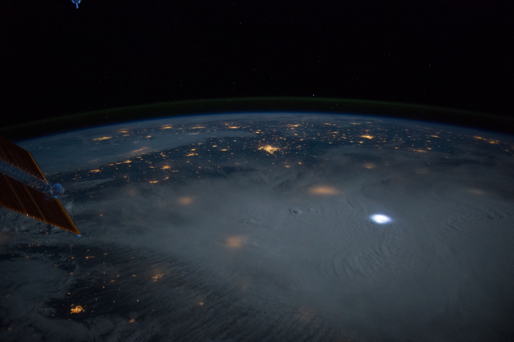 Space, Stars, Moon, Earth, Clouds, Lightning, and City Lights, June 12, 2014 at 06:39:24 GMT, As Seen From the International Space Station (Expedition 40) While Orbiting Above Hay Springs, Nebraska, USA, North America, Latitude (LAT): 42.6, Longitude (LON): -102.7, Altitude (ALT): 219 Nautical Miles, Sun Azimuth (AZI): 357 degrees, Sun Elevation Angle (ELEV): -24 degrees. Photo Credit: NASA; ISS040-E-10359, International Space Station (Expedition 40); Image Science and Analysis Laboratory, NASA-Johnson Space Center. "The Gateway to Astronaut Photography of Earth." <http://eol.jsc.nasa.gov/scripts/sseop/photo.pl?mission=ISS040&roll=E&frame=10359>; National Aeronautics and Space Administration (NASA, http://www.nasa.gov), Government of the United States of America (USA).