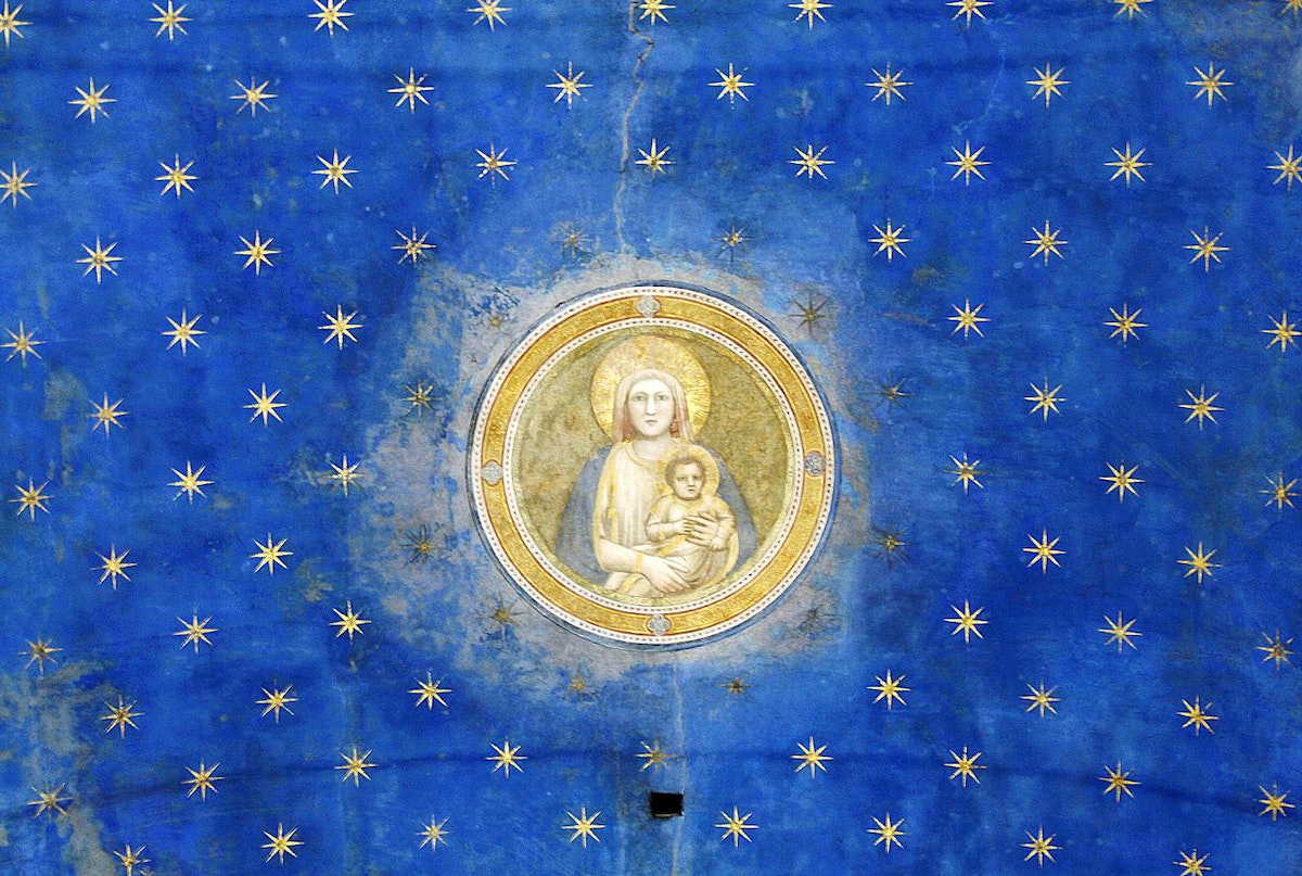 Virgin Mary and stars Arena Chapel in Padua Giotto)
caption={Detail featuring the Virgin Mary, from the ceiling of the Capella degli Scrovegni (Arena Chapel), in Padua, magnificently adorned with Giotto frescoes in ca. 1305. For the luminous blue throughout Giotto made use of ultramarine, which, due to its chemistry and expense, had to be applied on top of the already-dry fresco (*fresco secco*) — <a href=_https_/commons.wikimedia.org/wiki/File_Virgin_Mary_-_Ceiling_-_Capella_degli_Scrovegni_-_Padua_2016.jpg__Source_/a_.html (Photo: José Luiz Bernardes Ribeiro, [CC BY-SA 4.0](https://creativecommons.org/licenses/by-sa/4.0/))