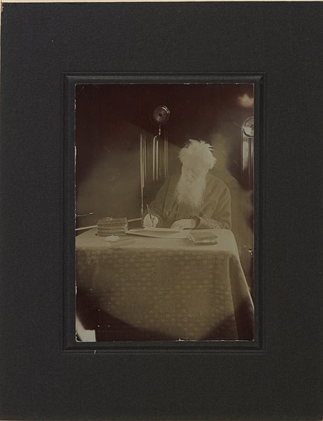 File:Reverend William Booth, General of the Salvation Army sitting at a table apparently writing and with a book resting on table in front of him (HS85-10-22544).jpg